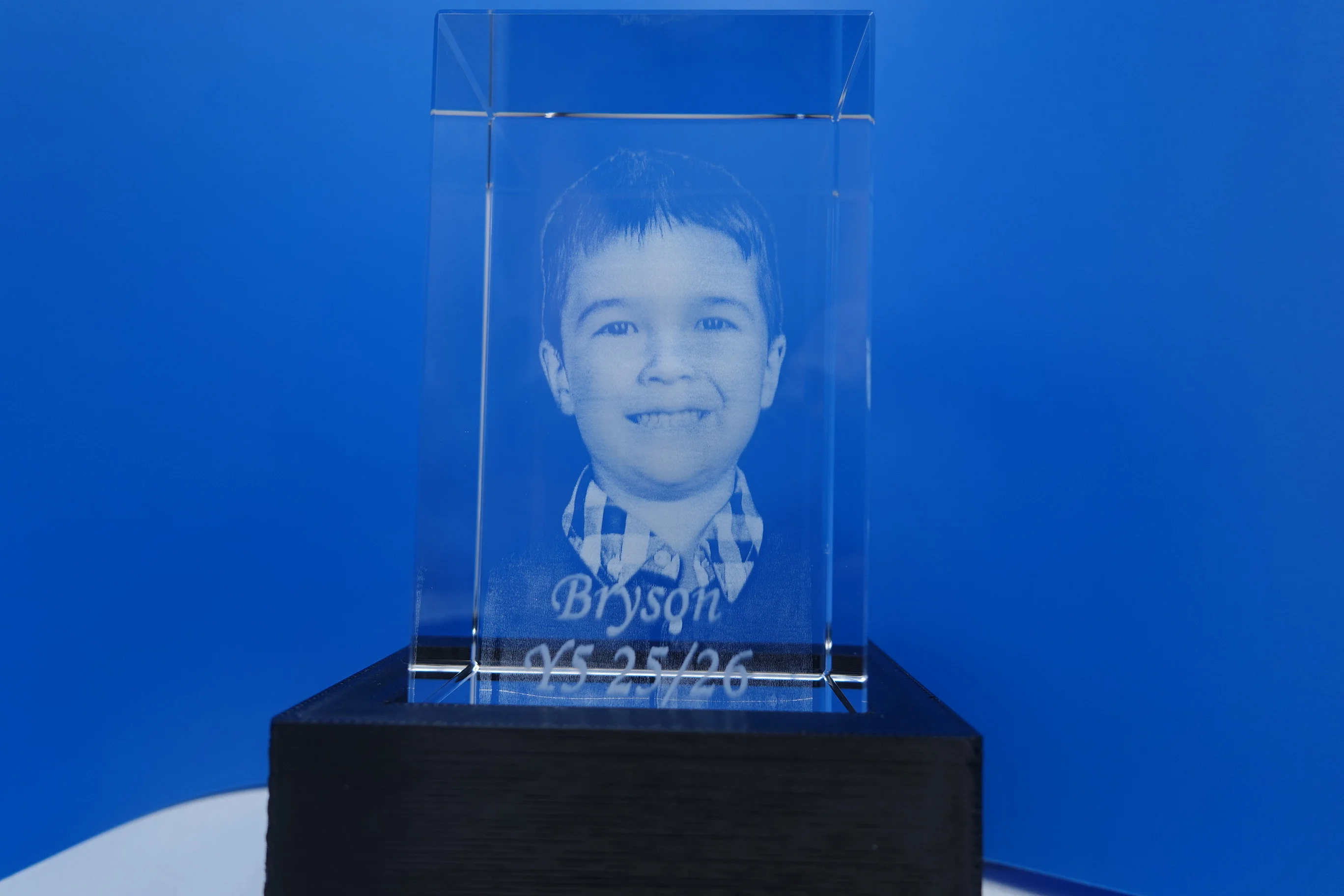 3D crystal photo engraving in blue light